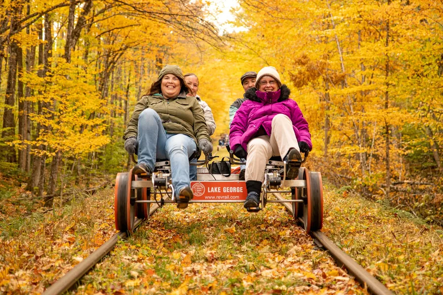 Rail bikes on the track through autumn woods