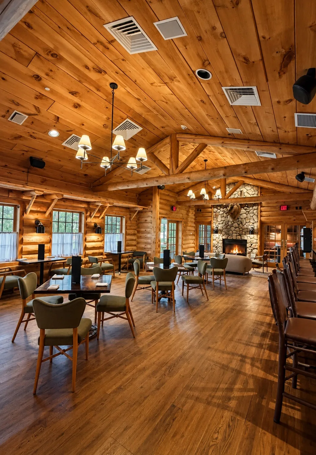 Centennial Kitchen: a timber dining room with a stone fireplace